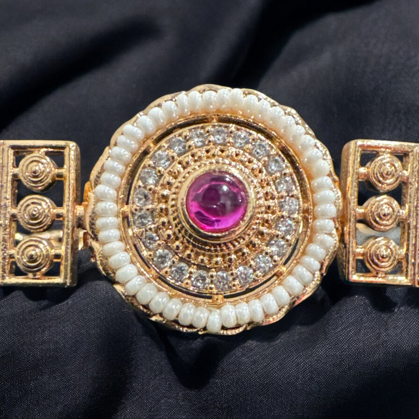 Traditional Bracelet Design with Pearls and Ruby in the Center