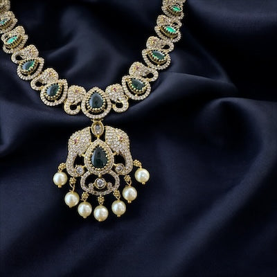 Chic AD Victorian Finish Necklace Set with Green Stones and Ganesha Motifs