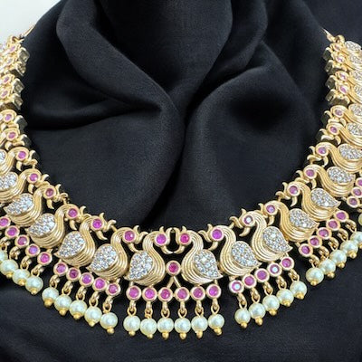 Elegant Peacock Motif Necklace Set with Jhumka in Gold with Pearls