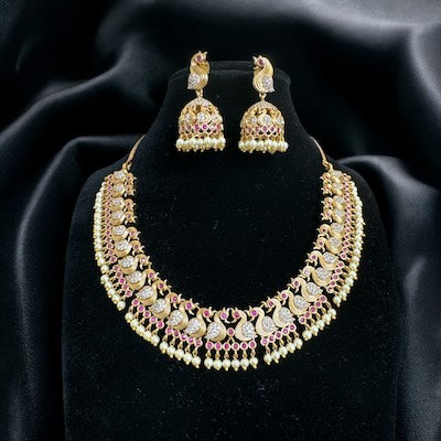 Elegant Peacock Motif Necklace Set with Jhumka in Gold with Pearls