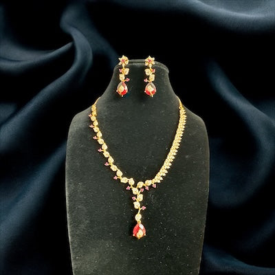 Glamorous AD Necklace Set in Gold Finish with Red Tear Drop